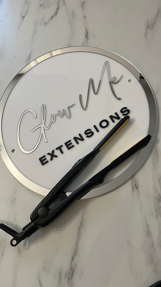 Fer à fixer les extensions adhésives